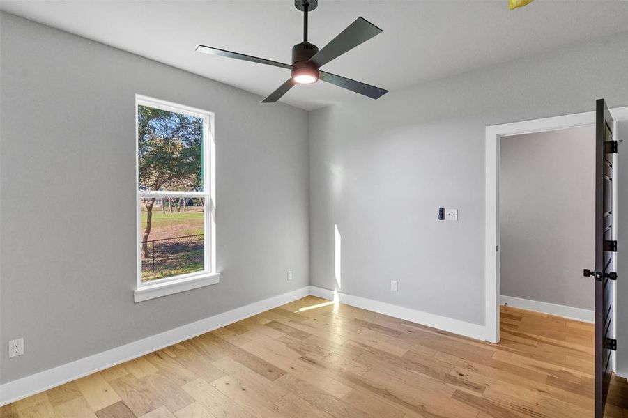 Unfurnished bedroom with light wood-style flooring and a ceiling fan