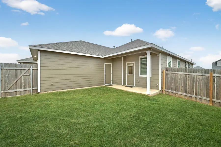 Rear view of house with roof with shingles, a patio, and a fenced backyard Rear view of house with roof with shingles, a patio, and a fenced backyard