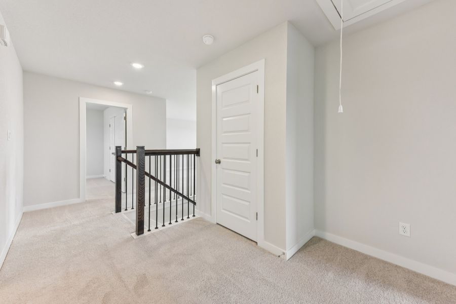 A hallway with white doors. A hallway with white doors.