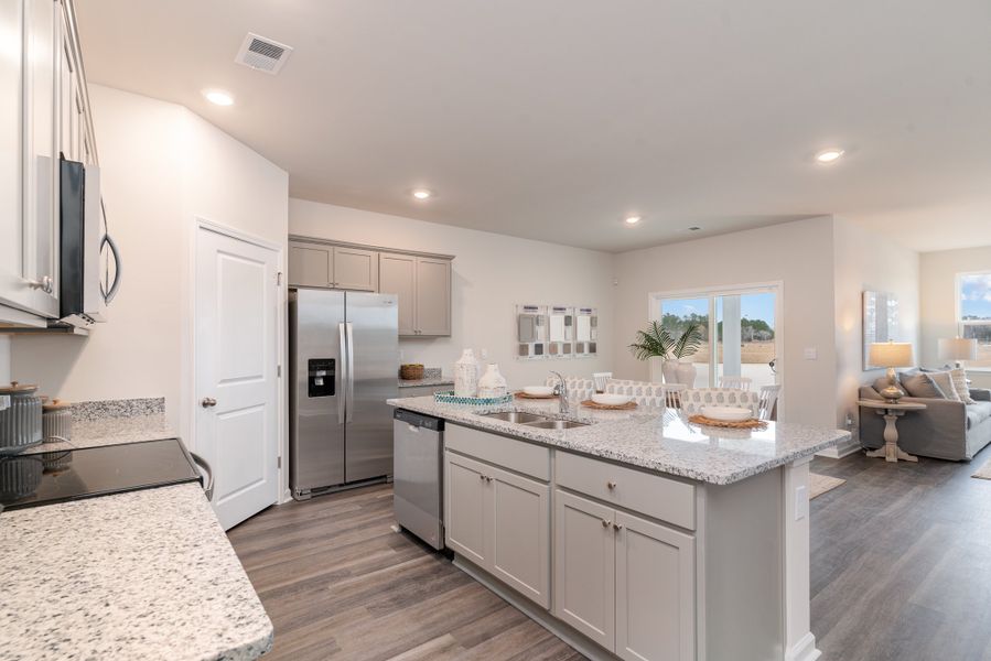 Representative furnished interior of a home built from the DOVER by D.R. Horton in Kingston Bay, Conway (Image 12).