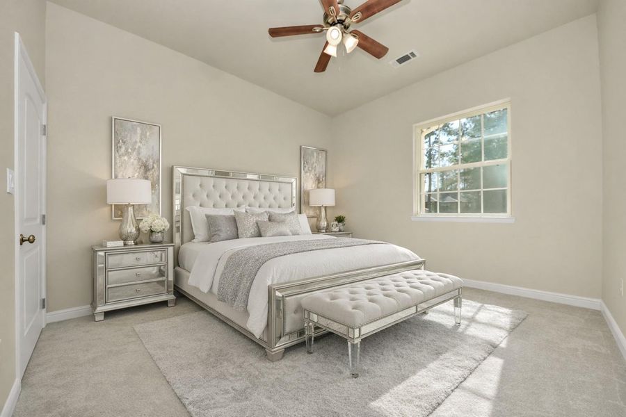And a fourth virtually staged bedroom featuring a large window, plush carpeting, and neutral walls.