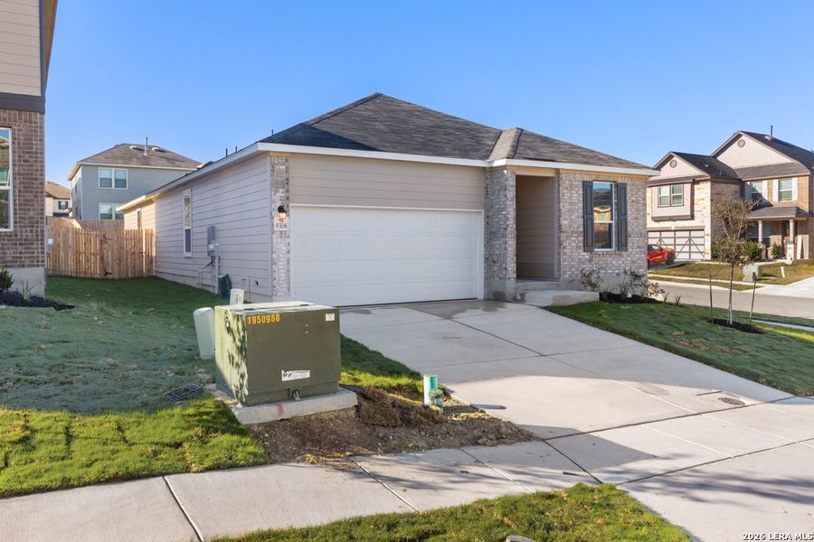 Front exterior of a new home in Knox Ridge, Converse, TX, highlighting curb appeal (Image 2). Front exterior of a new home in Knox Ridge, Converse, TX, highlighting curb appeal (Image 2).