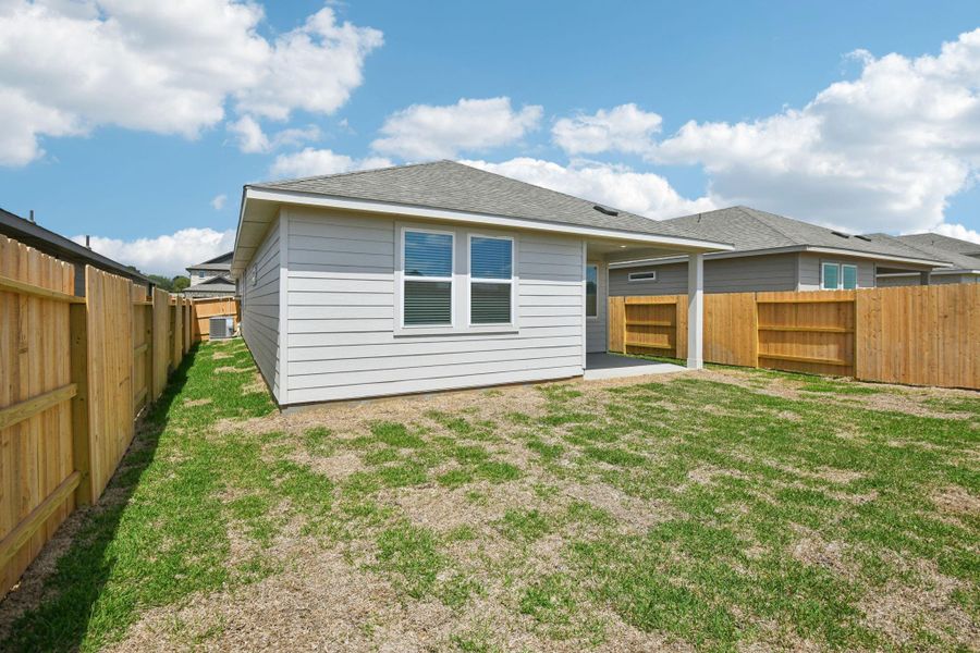 Exterior details and patio area of a home in Sanford Farms - Traditional Series, Waller (Image 29).