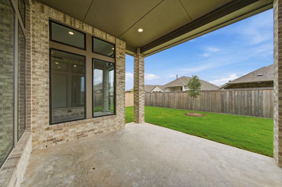 Exterior details and patio area of a home in Bridgeland 50′, Cypress (Image 25).
