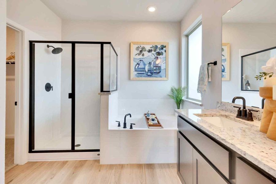 Relax in the deep soaking tub or step into the glass-enclosed shower. Relax in the deep soaking tub or step into the glass-enclosed shower.