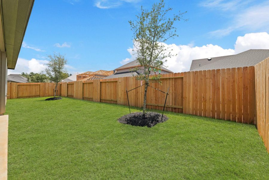 Front exterior of a new home in Silverthorne, Conroe, TX, highlighting curb appeal (Image 2).