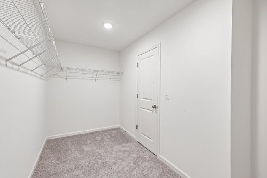 A hallway with white walls. A hallway with white walls.