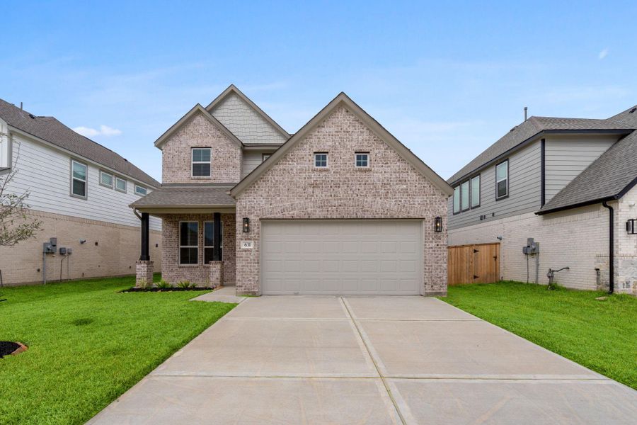 Front exterior of a new home in Huntington Place, Rosharon, TX, highlighting curb appeal (Image 17). Front exterior of a new home in Huntington Place, Rosharon, TX, highlighting curb appeal (Image 17).