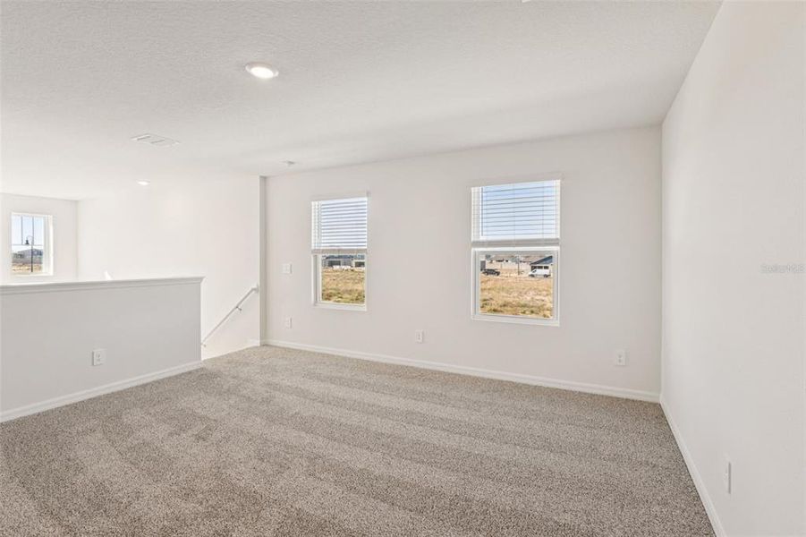 Spacious, unfurnished interior of a new home in The Reserve at Hammock Oaks - Classic Series, Lady Lake (Image 14).