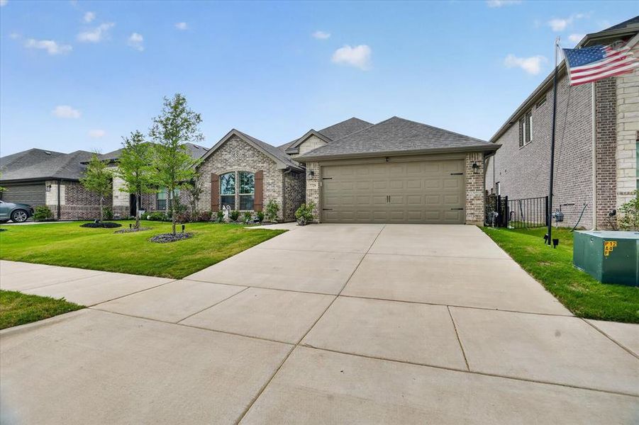 Front exterior of a new home in Silo Mills, Joshua, TX, highlighting curb appeal (Image 24).