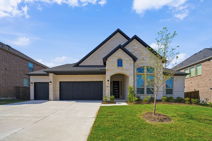 Front exterior of a new home in Sonoma Verde, Heath, TX, highlighting curb appeal (Image 1). Front exterior of a new home in Sonoma Verde, Heath, TX, highlighting curb appeal (Image 1).