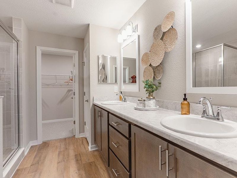 Your suite is complete with an en-suite bath with a large tiled shower - Birch townhome by Highland Homes Your suite is complete with an en-suite bath with a large tiled shower - Birch townhome by Highland Homes