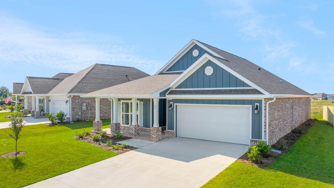 Front exterior of a new home in Owl's Head Farms, Freeport, FL, highlighting curb appeal (Image 15). Front exterior of a new home in Owl's Head Farms, Freeport, FL, highlighting curb appeal (Image 15).