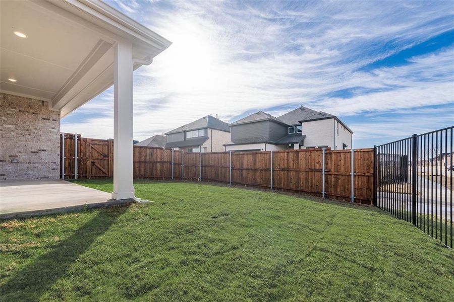 Exterior details and patio area of a home in Villages of Creekwood, Frisco (Image 4).