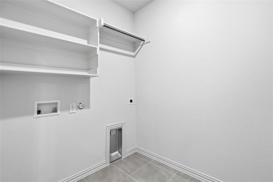 Laundry room featuring electric dryer hookup, washer hookup, hookup for a gas dryer, and light tile patterned flooring