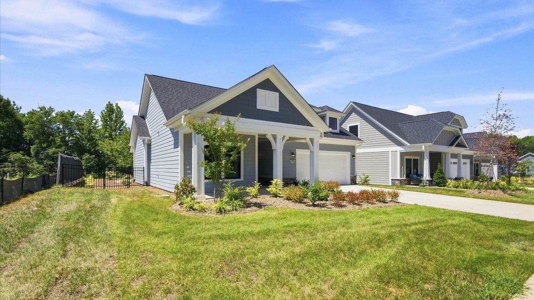 Front exterior of a new home in The Courtyards at Hodges Farm, Charlotte, NC, highlighting curb appeal (Image 2).