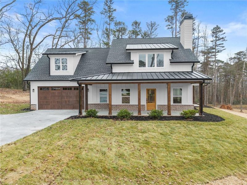Front exterior of a new home in , Clermont, GA, highlighting curb appeal (Image 1). Front exterior of a new home in , Clermont, GA, highlighting curb appeal (Image 1).