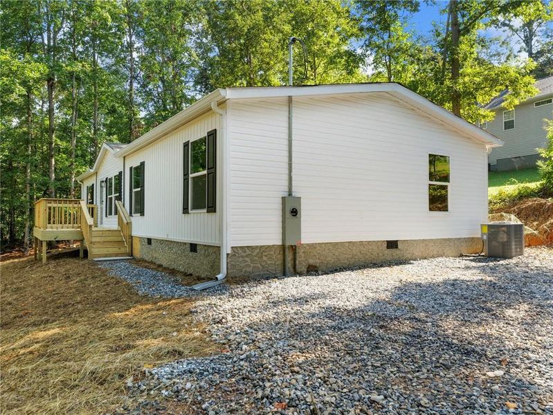 Exterior details and patio area of a home in , Clarkesville (Image 23).