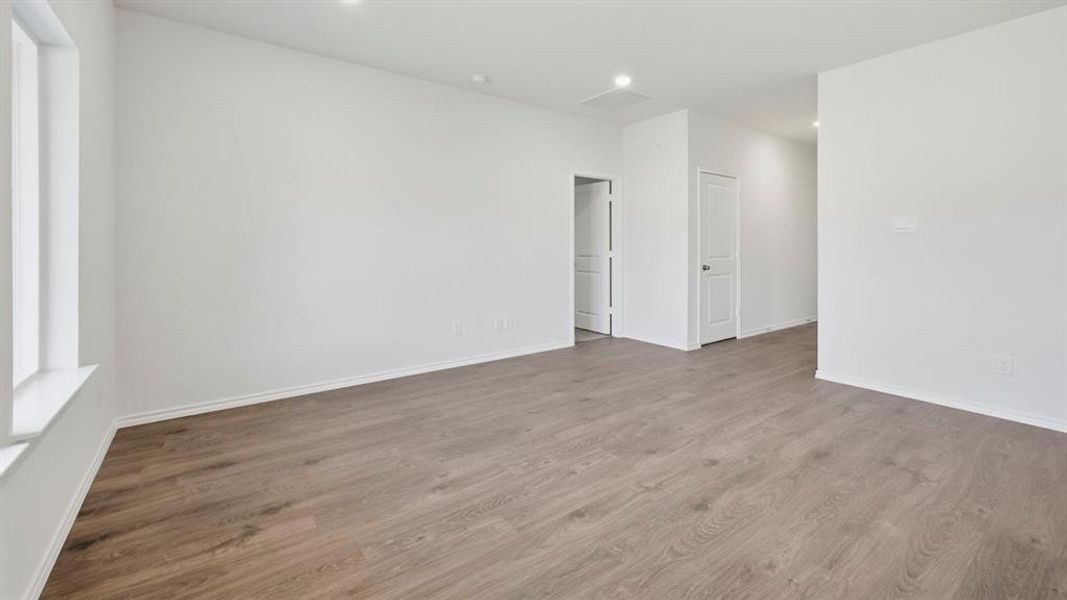 Spare room with light wood-style floors and recessed lighting Spare room with light wood-style floors and recessed lighting