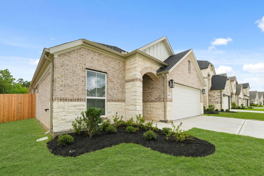 Front exterior of a new home in Barton Creek Ranch, Conroe, TX, highlighting curb appeal (Image 15). Front exterior of a new home in Barton Creek Ranch, Conroe, TX, highlighting curb appeal (Image 15).