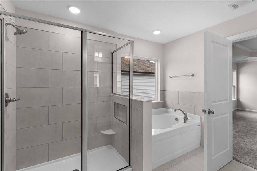 Walk-in Shower and Tub in Primary Bathroom | 5085 Anna Creek Way by Ivey Homes