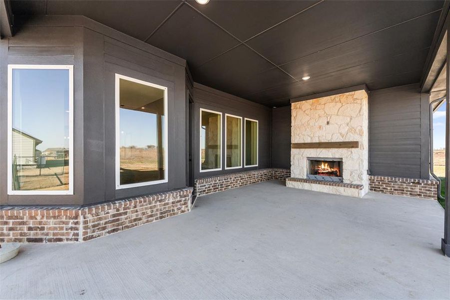 View of patio / terrace featuring a fireplace