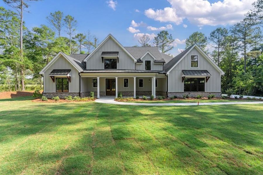 Front exterior of a new home in , Carrollton, GA, highlighting curb appeal (Image 23).