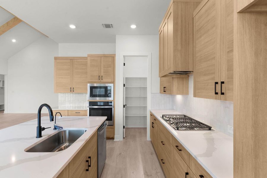 Furnished interior view inside a new home in The Grove at Blackhawk, Pflugerville (Image 14).
