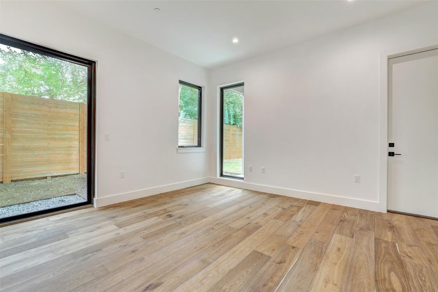 Empty room featuring light wood-style floors and recessed lighting Empty room featuring light wood-style floors and recessed lighting