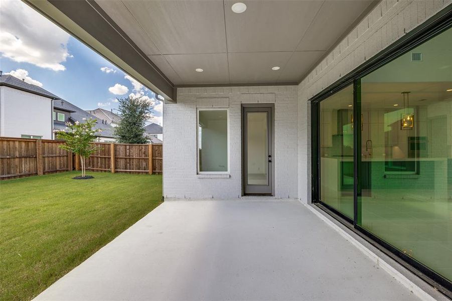 Covered outdoor patio with a concrete surface Covered outdoor patio with a concrete surface
