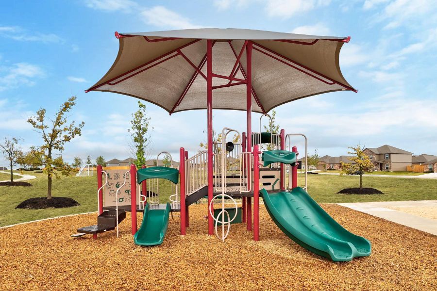 Community playground featuring a yard