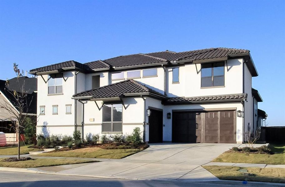 View of front of property with a garage