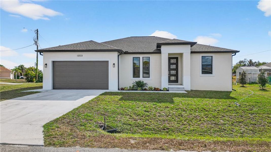 Front exterior of a new home in , North Port, FL, highlighting curb appeal (Image 26).