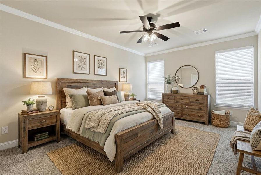 VIRTUALLY STAGED Bedroom with light colored carpet, crown molding, and ceiling fan