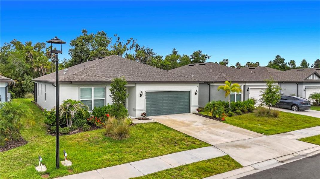 Front exterior of a new home in , Ellenton, FL, highlighting curb appeal (Image 22). Front exterior of a new home in , Ellenton, FL, highlighting curb appeal (Image 22).