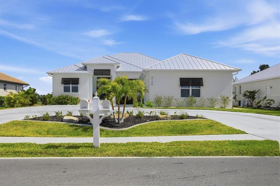 Front exterior of a new home in , Placida, FL, highlighting curb appeal (Image 21).