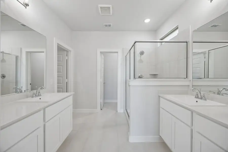 Primary Bathroom in the Masters home plan by Trophy Signature Homes – REPRESENTATIVE PHOTO