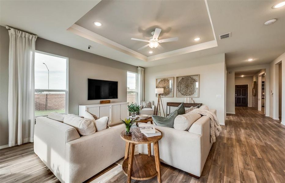 Sun-bathed gathering room with expansive room for entertaining *Real Home pictured, former model.