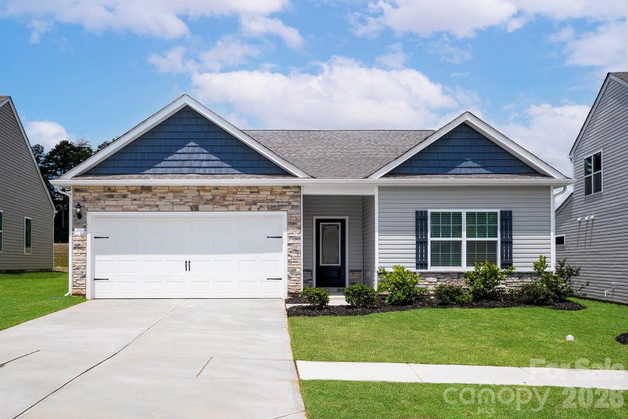 Front exterior of a new home in Ascot Woods, Charlotte, NC, highlighting curb appeal (Image 1). Front exterior of a new home in Ascot Woods, Charlotte, NC, highlighting curb appeal (Image 1).
