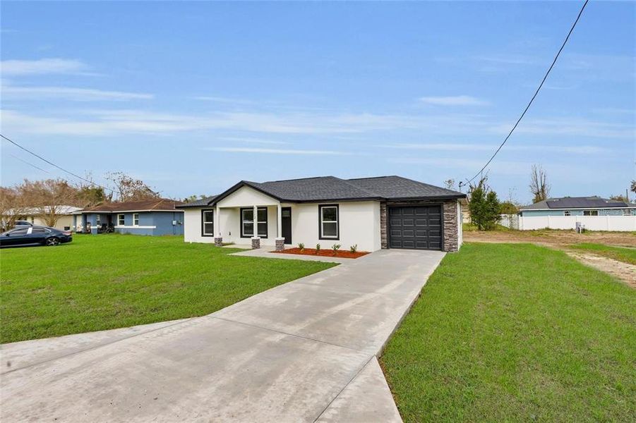 Front exterior of a new home in , Ocala, FL, highlighting curb appeal (Image 19). Front exterior of a new home in , Ocala, FL, highlighting curb appeal (Image 19).