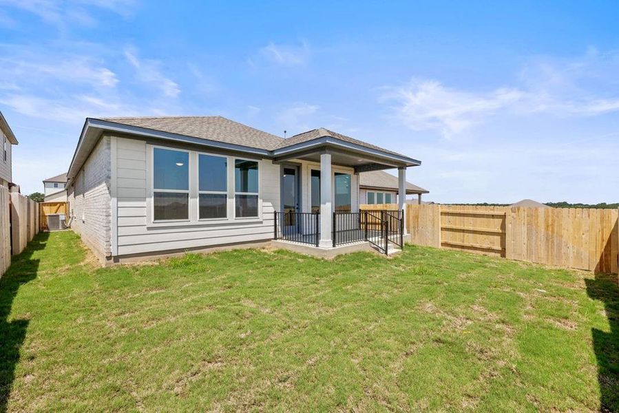 Exterior details and patio area of a home in Lariat, Liberty Hill (Image 20).