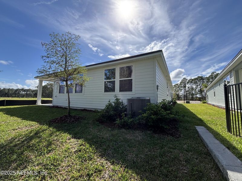 Front exterior of a new home in The Magnolia Series at Reserve East, Flagler Beach, FL, highlighting curb appeal (Image 19).