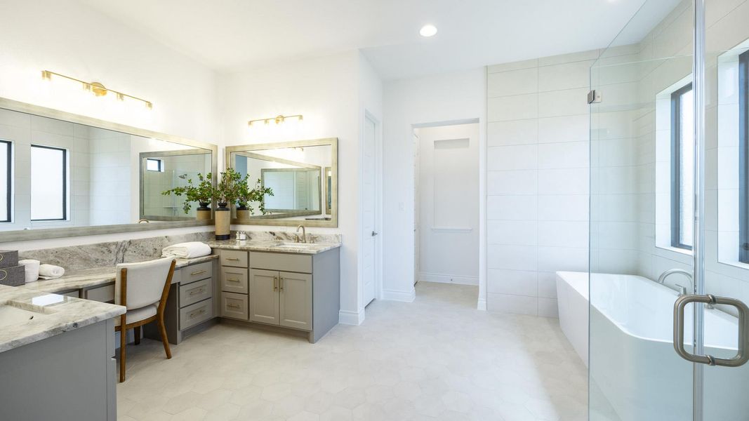 Full bathroom with a freestanding tub, tile patterned floors, recessed lighting, and vanity Full bathroom with a freestanding tub, tile patterned floors, recessed lighting, and vanity