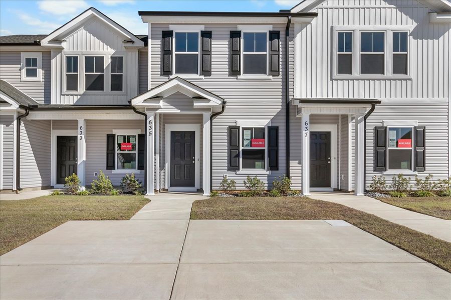 Front exterior of a new home in Windsor Townhomes, North Augusta, SC, highlighting curb appeal (Image 1).