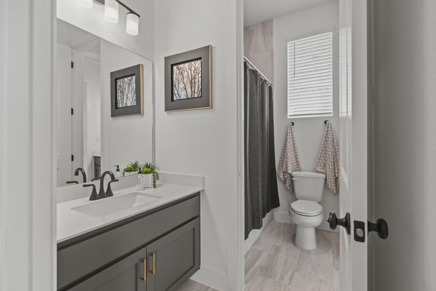 Representative furnished interior of a home built from the Silas by Chesmar Homes in 6 Creeks, Kyle (Image 14).