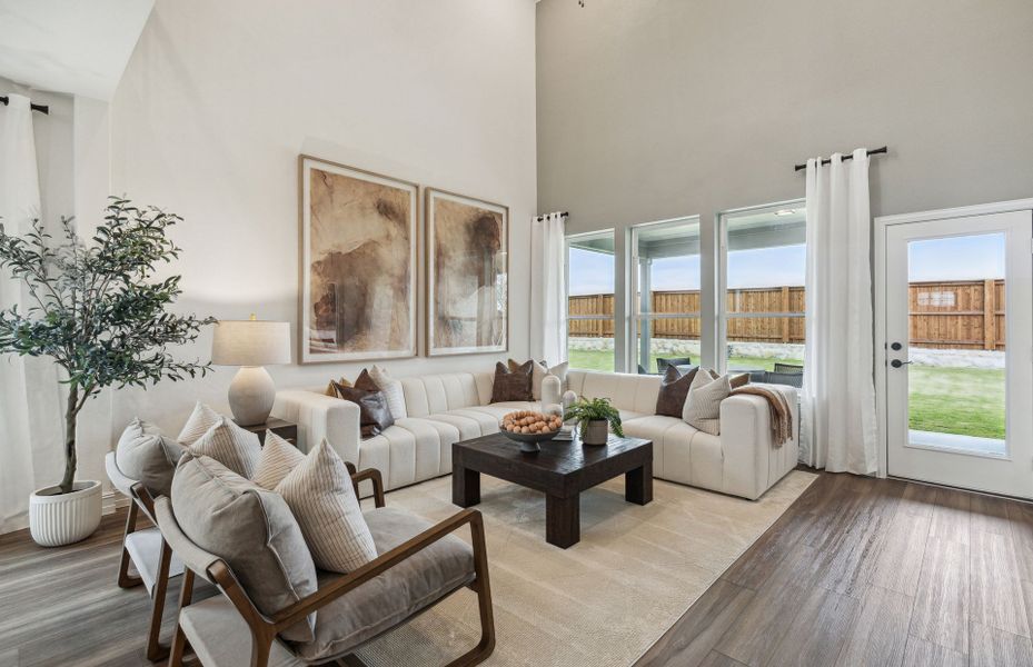 Spacious Gathering Room Overlooking the Covered Backyard Patio