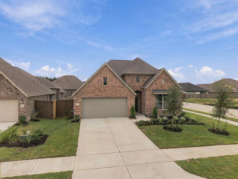 Front exterior of a new home in The Trails, New Caney, TX, highlighting curb appeal (Image 1). Front exterior of a new home in The Trails, New Caney, TX, highlighting curb appeal (Image 1).