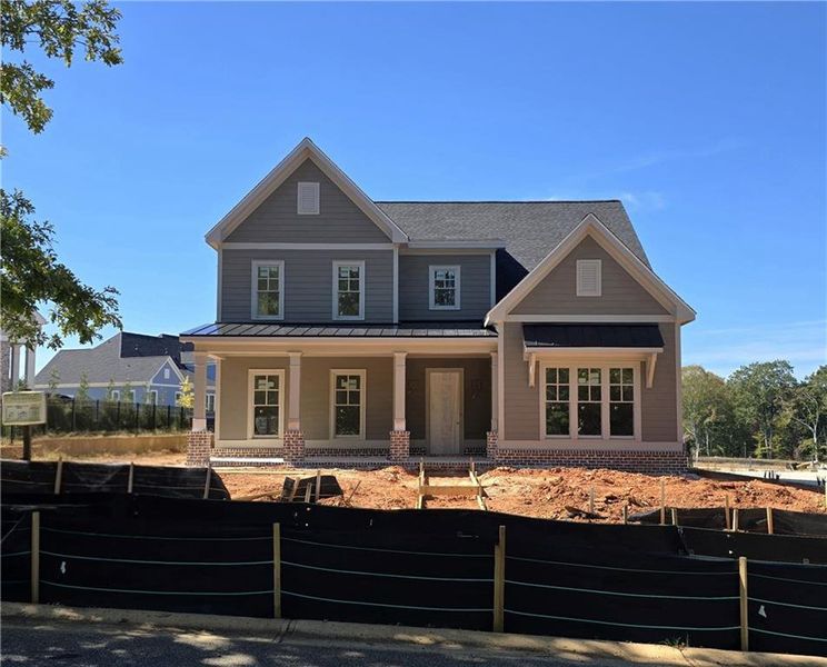 Front exterior of a new home in , Statham, GA, highlighting curb appeal (Image 1). Front exterior of a new home in , Statham, GA, highlighting curb appeal (Image 1).