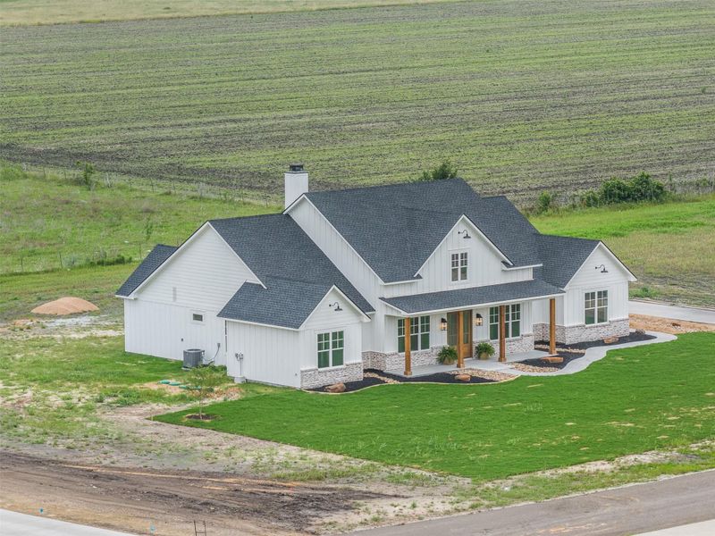 Front exterior of a new home in , Snook, TX, highlighting curb appeal (Image 27).