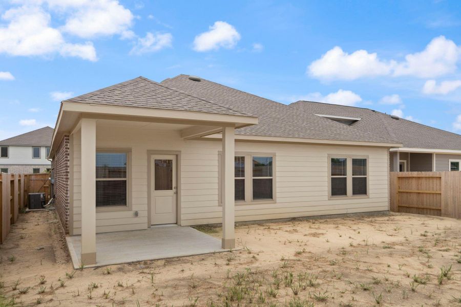 Front exterior of a new home in River Ranch Trails, Dayton, TX, highlighting curb appeal (Image 15).